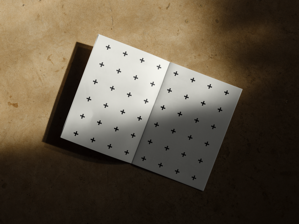 Magazine 04 — Open, on concrete floor mockup surface