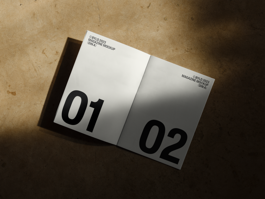 Magazine 04 — Open, on concrete floor mockup surface