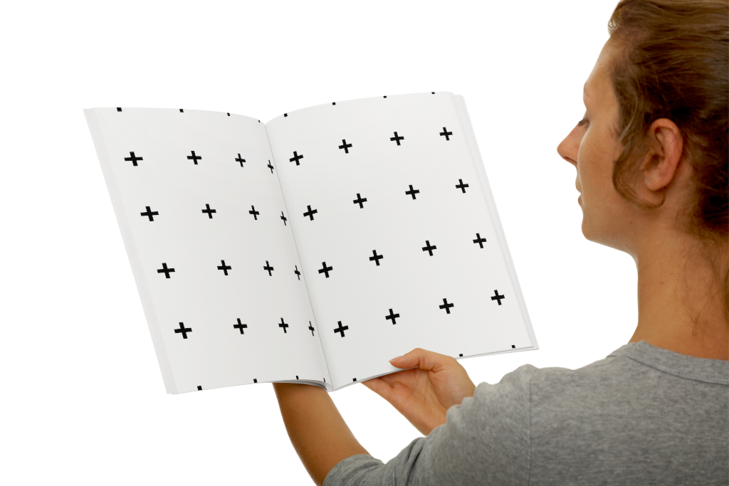 Magazine 0247 — In hands, open mockup surface