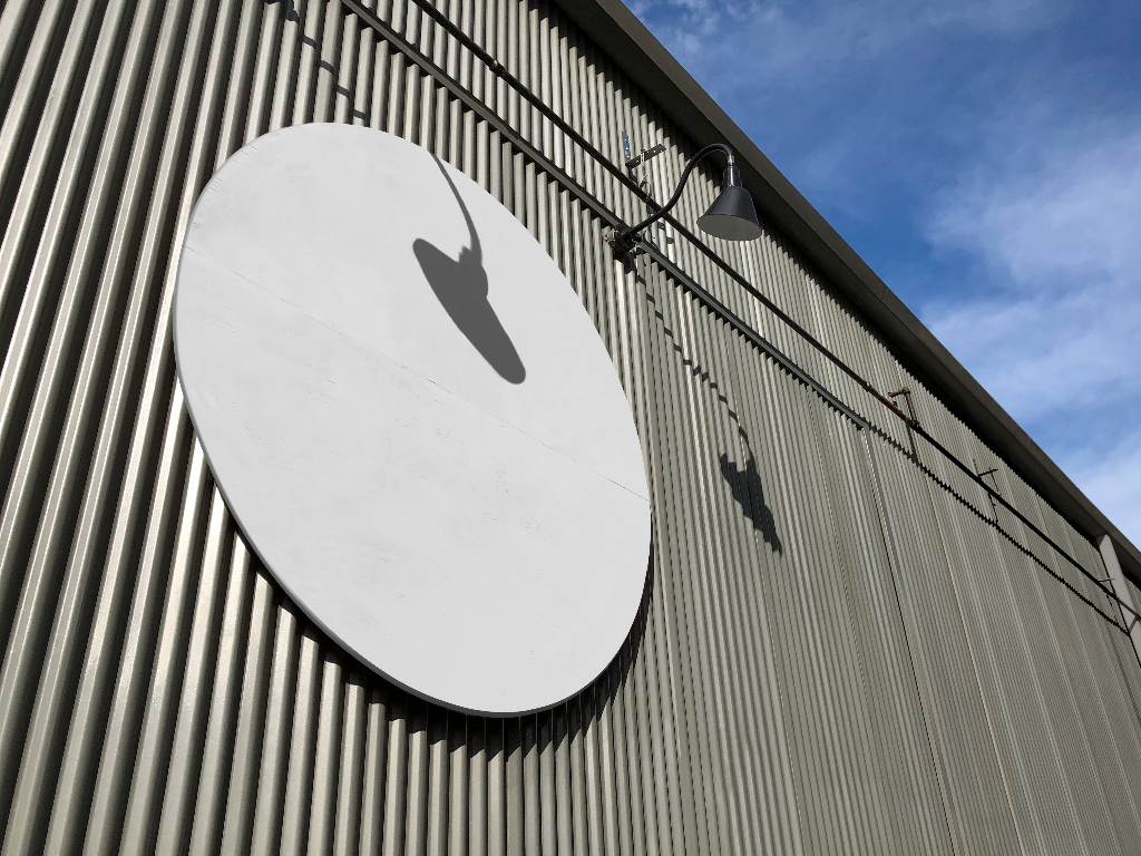 Sign 1985 — On building mockup surface