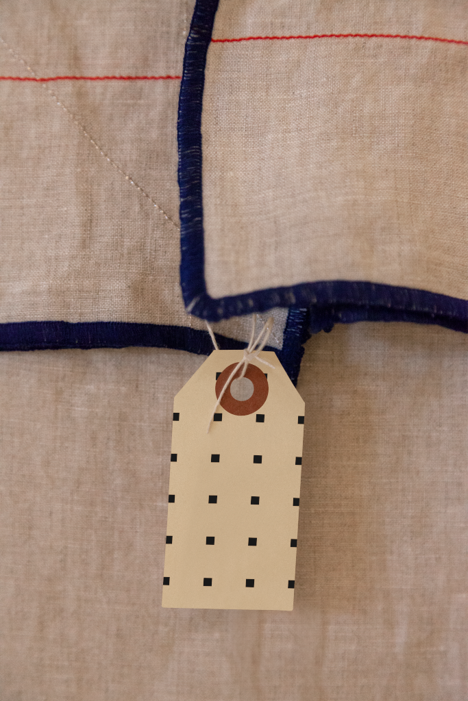 Tag 1518 — On textile mockup surface