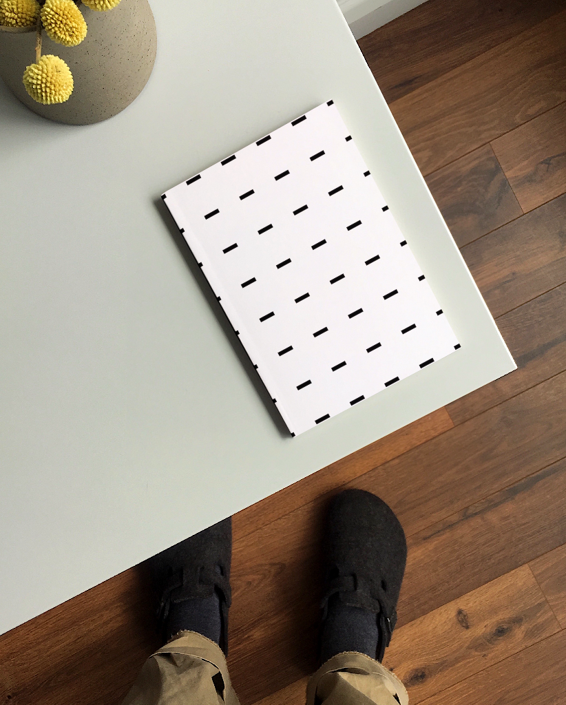 Book 2144 — Softcover, on table mockup surface