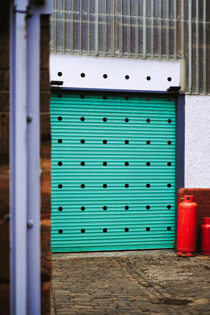 Door 2074 — Corrugated metal, with sign mockup surface