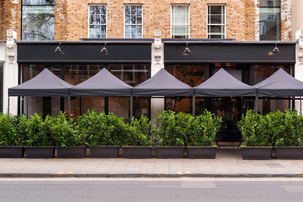 Storefront 2335 — Front, with umbrellas mockup surface