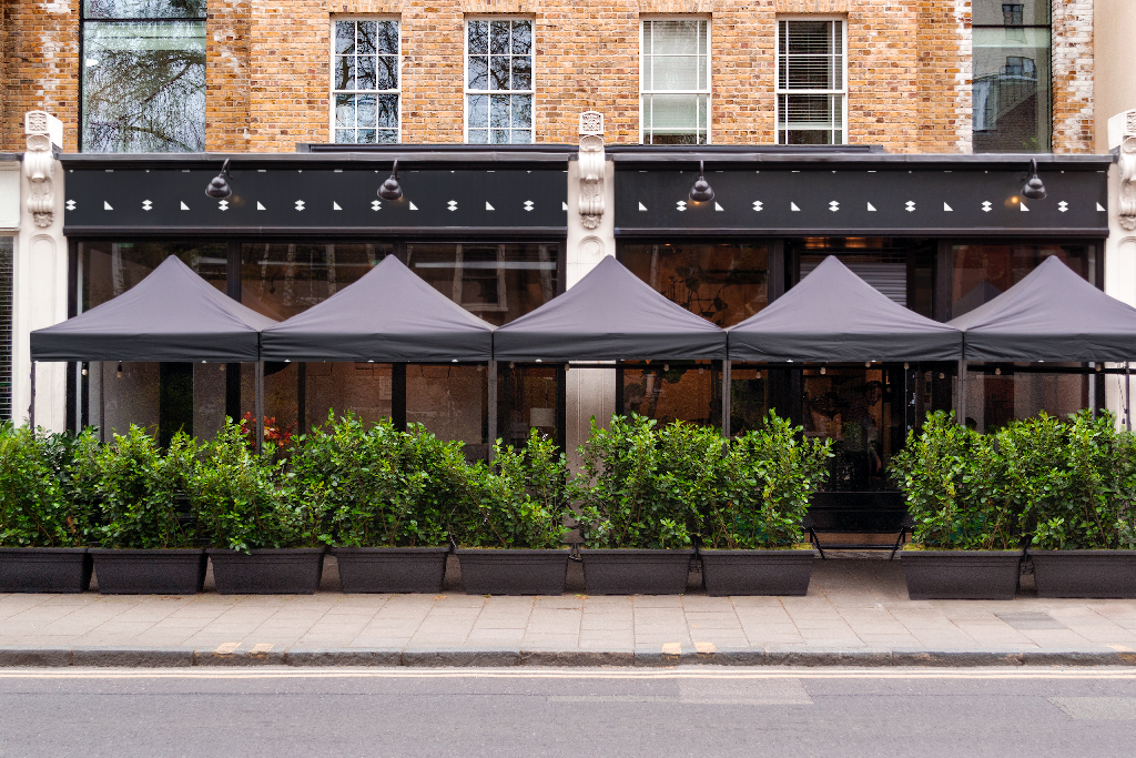 Storefront 2335 — Front, with umbrellas mockup surface