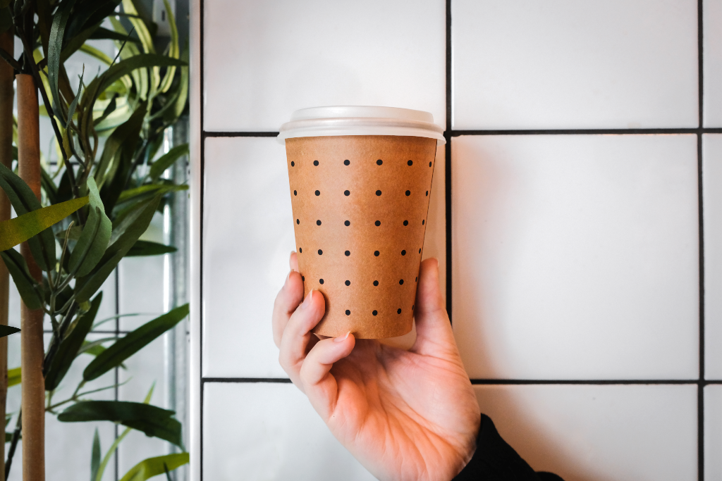 Cup 2055 — Kraft, held mockup surface