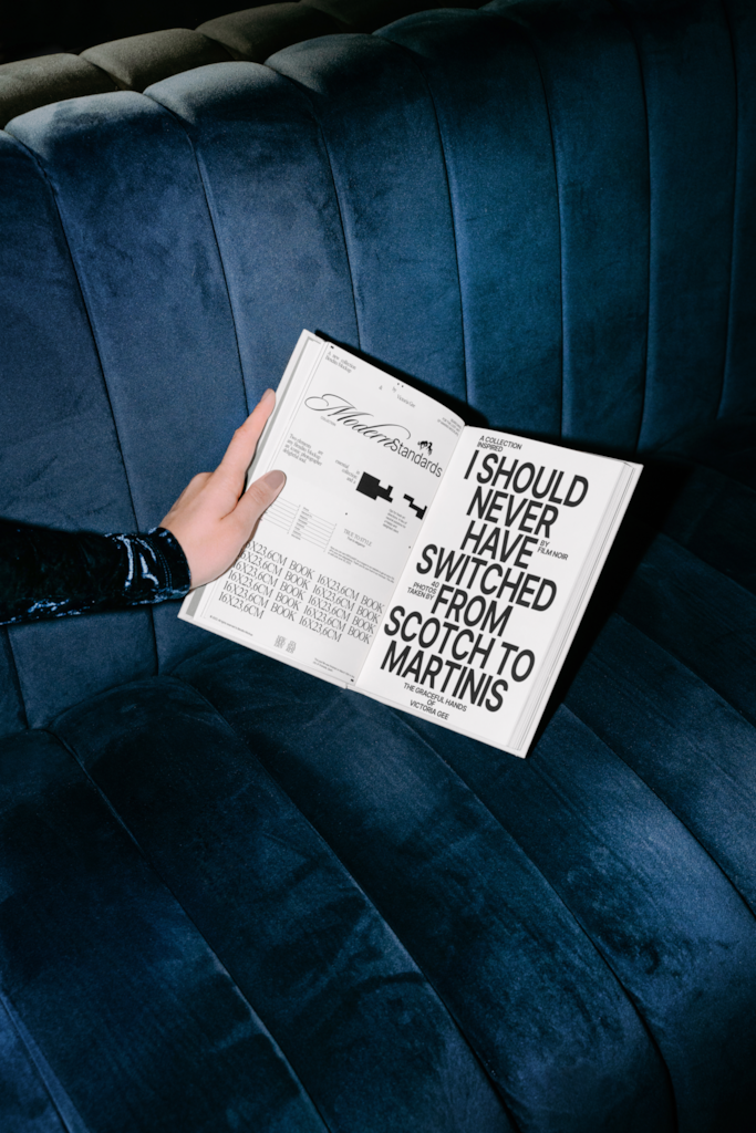 MS Book 01 — Open, held mockup surface