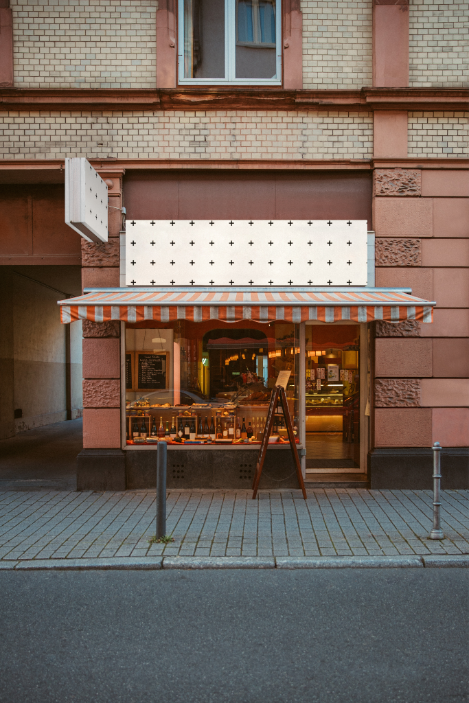 Sign 2065 — On storefront mockup surface