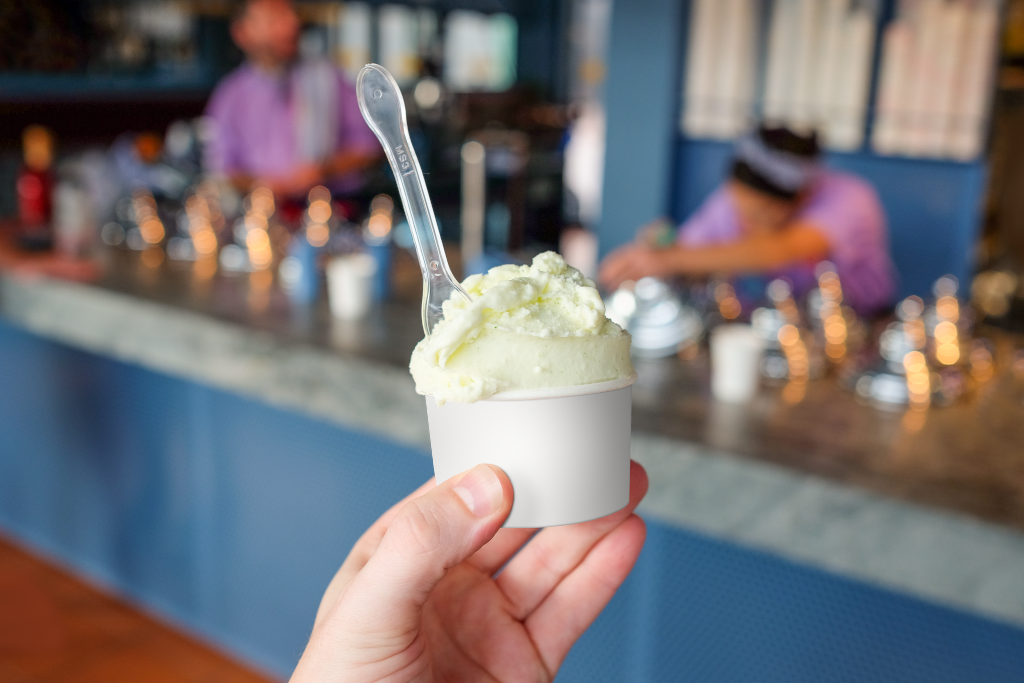 Cup 2057 — Held, with ice cream mockup surface