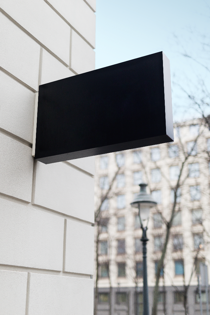 Sign 2120 — Mounted, on building mockup surface