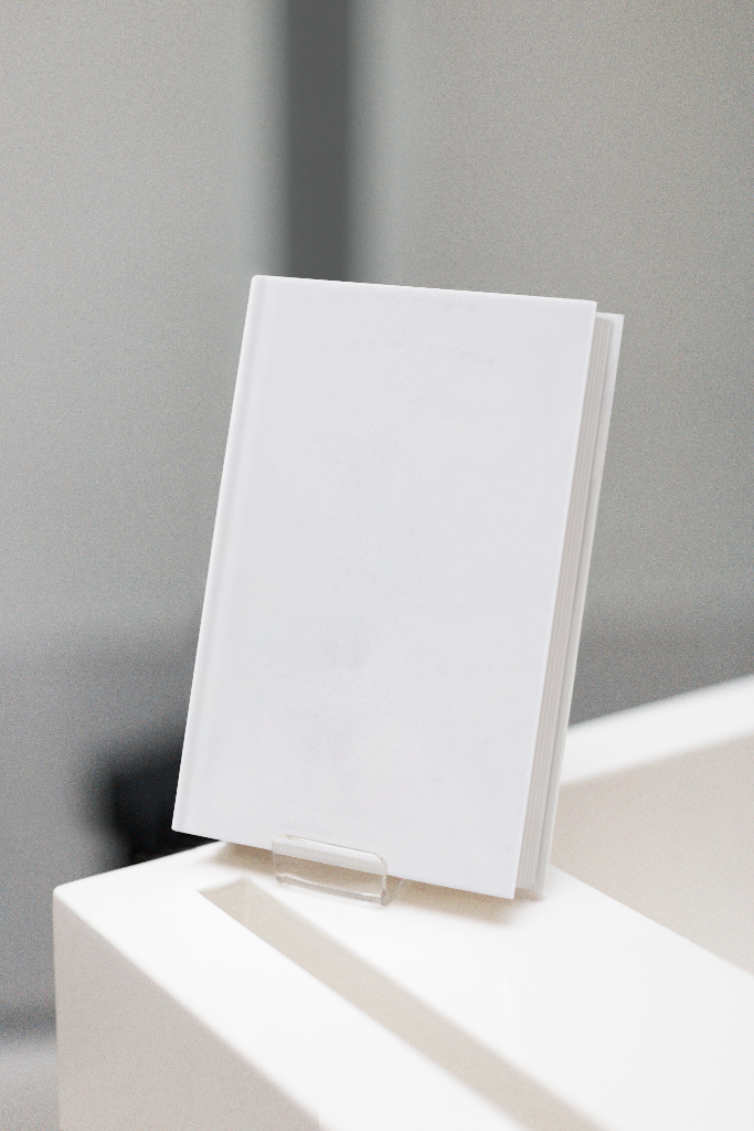 Book 2109 — Hardcover, no jacket, on stand mockup surface