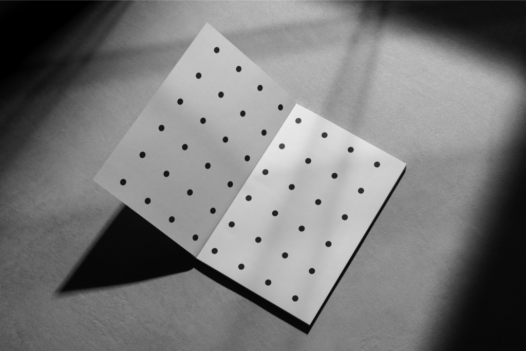 Magazine 06 — Open, on concrete floor mockup surface